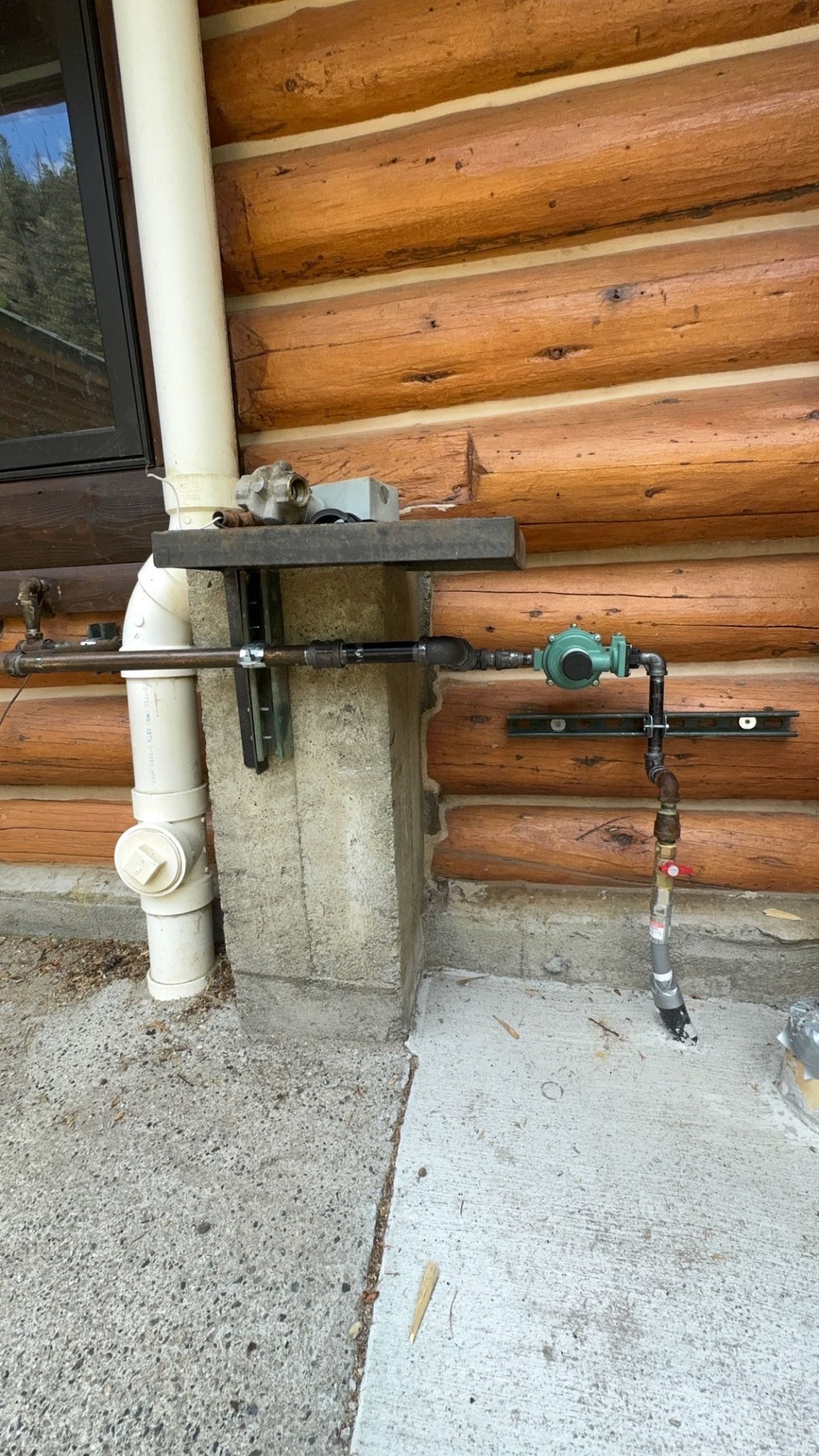Gas line installation on log cabin by Wrangler Plumbing in Cody, Wyoming